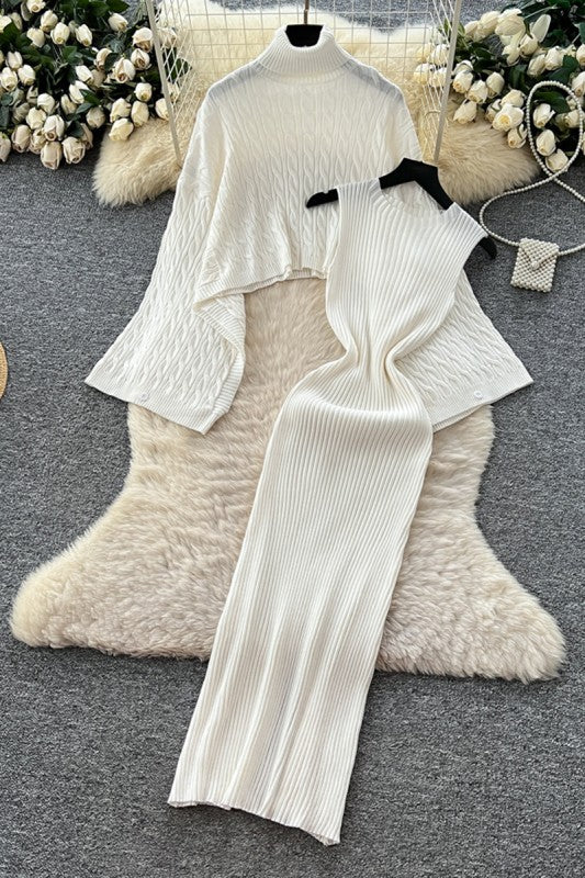 White knit outfit on a hanger with decorative background